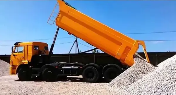 a truck loaded with gravel